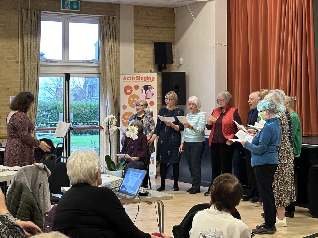 Members of the ActivSinging serenading an audience during an event