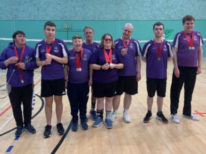 Badminton Players posed after receiving their medals from winning in the competition