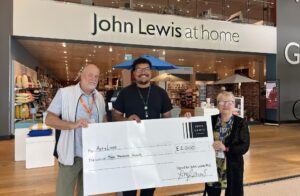 ActivLives CEO Julie Stokes and Partnership & Fundraising Officer receiving the cheque from John Lewis & Partners